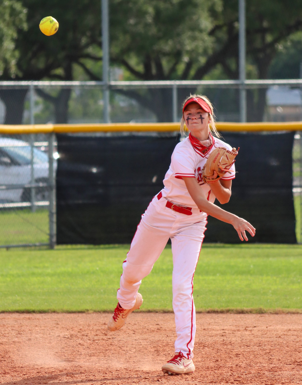 Katy High sophomore shortstop Peyton Watson relays a throw during Game 1 of the team’s area playoff series against Houston Heights on Friday, May 7, at Katy High.